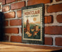 A vintage-style metal sign with the text "MONTCLAW NEW JERSEY" displayed on a brick wall.