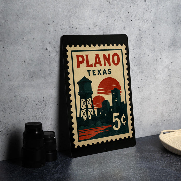 A framed poster of Plano, Texas, featuring a vintage-style illustration of the city skyline and a water tower.