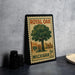 A vintage-style postage stamp featuring a tree and a store, with the text "ROYAL OAK" and "MICHIGAN 5¢ POSTAGE" printed on it.