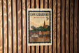 A vintage postage stamp from Cape Girardeau, Missouri, featuring a steamboat on the water and a church steeple in the background.