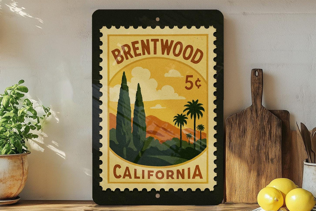 A framed vintage postage stamp depicting a scenic landscape of Brentwood, California, with palm trees and mountains in the background.