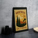 A framed stamp depicting a scenic landscape of Brentwood, California, with palm trees and mountains in the background.