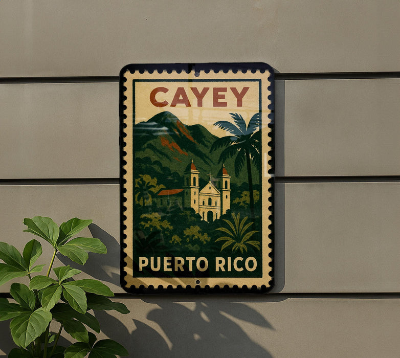 A vintage-style metal sign with the text "CAEY PUERTO RICO" displayed on it, featuring a tropical landscape with palm trees and a church.
