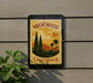 A vintage postage stamp depicting a scenic landscape of Brentwood, California, with palm trees and mountains in the background.