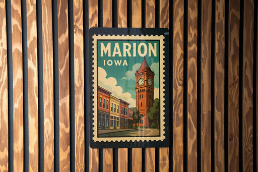 A vintage postage stamp from Marion, Iowa, featuring a clock tower and buildings, is displayed on a wooden wall.