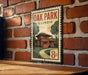 A vintage-style metal sign with the text "OAK PARK ILLINOIS" and an illustration of a house, mounted on a brick wall.