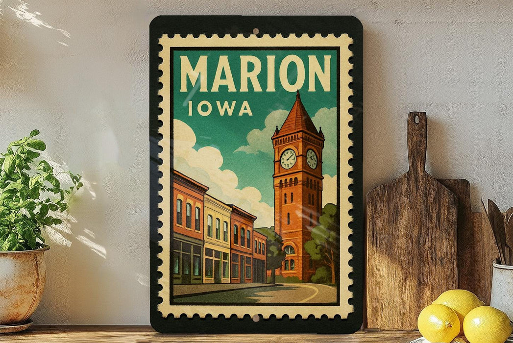 A framed vintage-style poster of Marion, Iowa, featuring a clock tower and a row of colorful buildings, is displayed on a shelf next to a wooden cutting board and some lemons.