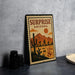 A vintage-style metal stamp depicting a desert landscape with mountains, cacti, and a city skyline, along with the text "Surprise Arizona USA 8c".