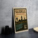A vintage postage stamp from Louisiana, featuring silhouettes of buildings and a river, is displayed on a table.