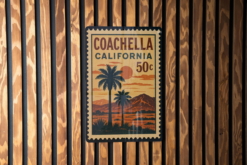 A vintage-style postage stamp from Coachella, California, featuring a palm tree and sunset landscape.
