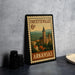 A framed vintage postage stamp from Fayetteville, Arkansas, featuring an illustration of a building and a clock tower.