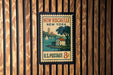 A vintage postage stamp from New Rochelle, New York, featuring a house and sailboats on a body of water.