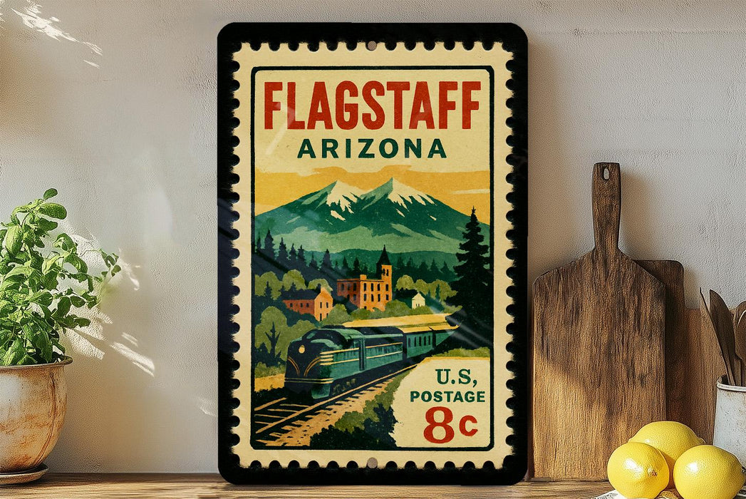 A vintage-style postage stamp from Flagstaff, Arizona, featuring a train and mountains, is displayed on a shelf next to a wooden cutting board and some lemons.