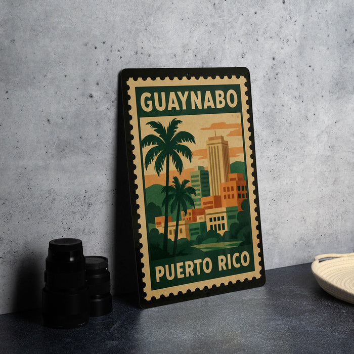 A metal sign with a tropical cityscape and palm trees, featuring the text "GUAYNABO PUERTO RICO" on it, is displayed on a table.