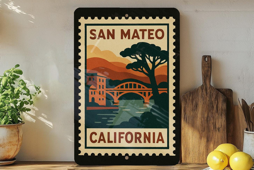 A framed poster of a bridge and mountains, with the text "SAN MATEO CALIFORNIA" on it, is displayed on a shelf next to a wooden cutting board and a potted plant.