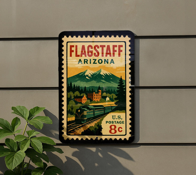 A vintage-style postage stamp depicting a train traveling through a scenic landscape, with mountains in the background and a building in the foreground.