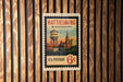 A vintage postage stamp from the United States, featuring the town of Hattiesburg, Mississippi.
