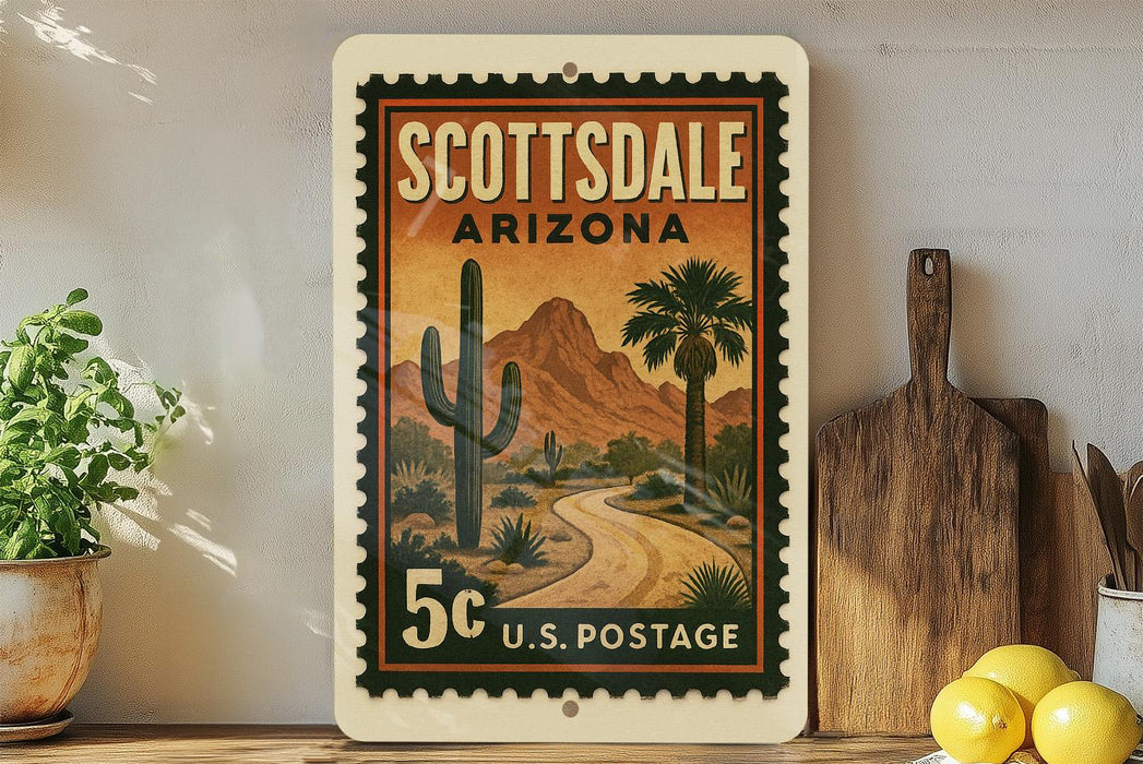 A vintage postage stamp from Scottsdale, Arizona, featuring a desert landscape with a road and cacti, displayed on a shelf next to a wooden cutting board and some lemons.