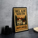 A framed poster of a house with the text "Bel Air South Maryland 15c" on it, placed on a countertop next to some black camera lenses.