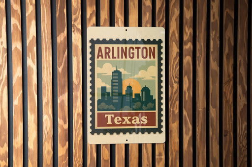 A vintage-style metal sign with the text "ARLINGTON TEXAS" displayed on it, mounted on a wooden wall.