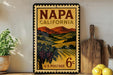 A vintage-style postage stamp from Napa, California, featuring a scenic countryside landscape with vineyards and mountains.