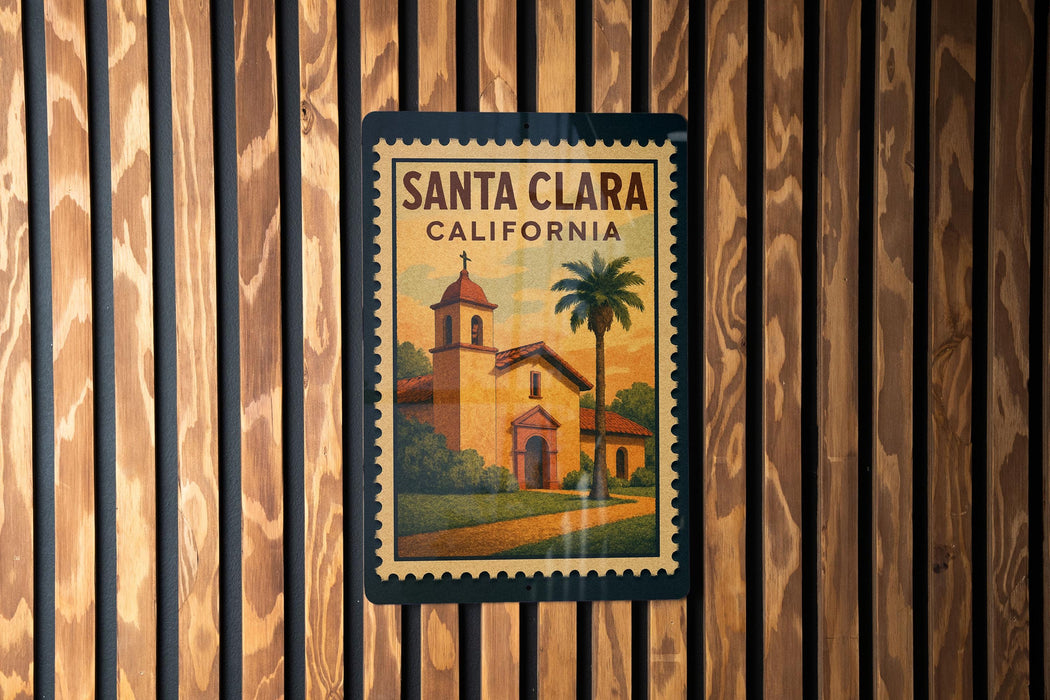 A framed poster of Santa Clara, California, featuring a church and palm trees, is displayed on a wooden wall.