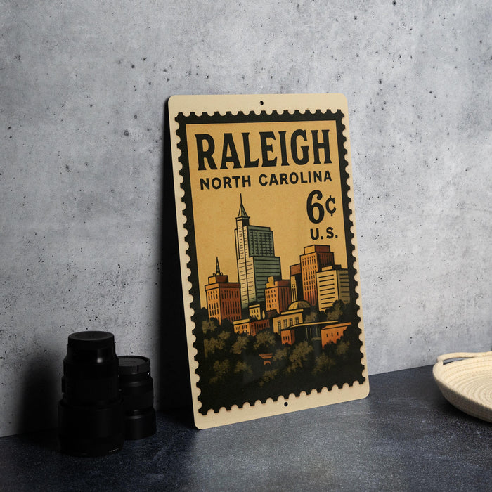 A vintage postage stamp from Raleigh, North Carolina, featuring an illustration of the city skyline.
