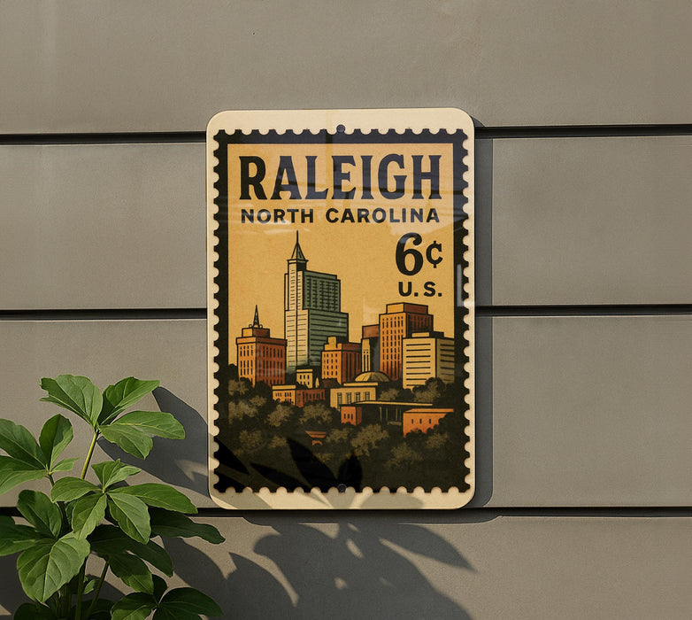 A postage stamp from Raleigh, North Carolina, featuring a cityscape with buildings and a tall skyscraper.