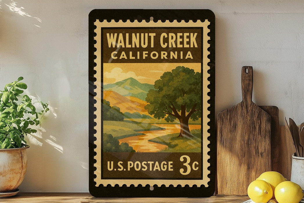 A vintage-style postage stamp for Walnut Creek, California, featuring a scenic landscape with a tree and mountains. The stamp is displayed on a shelf next to a wooden cutting board and a potted plant.