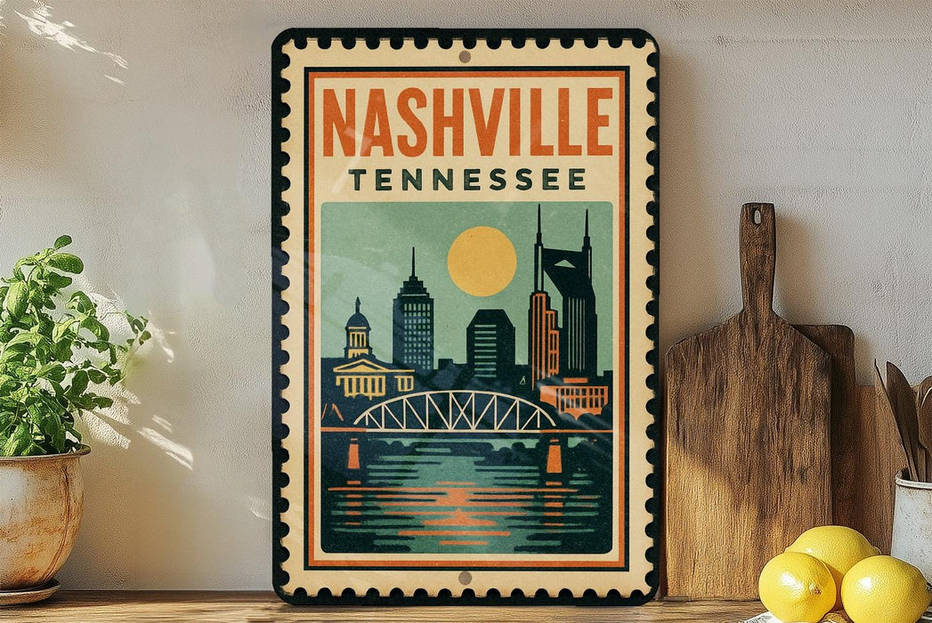 A vintage-style metal sign with the text "NASHVILLE TENNESSEE" and an illustration of a city skyline with a bridge, displayed on a shelf next to a wooden cutting board and some potted plants.