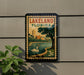 A vintage-style postage stamp from Lakeland, Florida, featuring a swan and a cityscape, is displayed on a wall.