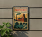 A vintage-style postage stamp depicting Pawtucket, Rhode Island, with a building and bridge in the background.