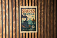 A vintage U.S. postage stamp from Sparks, Nevada, featuring a steam locomotive and desert landscape.