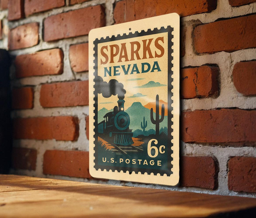 A vintage-style postage stamp from Sparks, Nevada, featuring a train and desert landscape, is displayed on a brick wall.