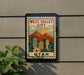 A sign for West Valley City, Utah, featuring a stylized illustration of the cityscape with mountains in the background.