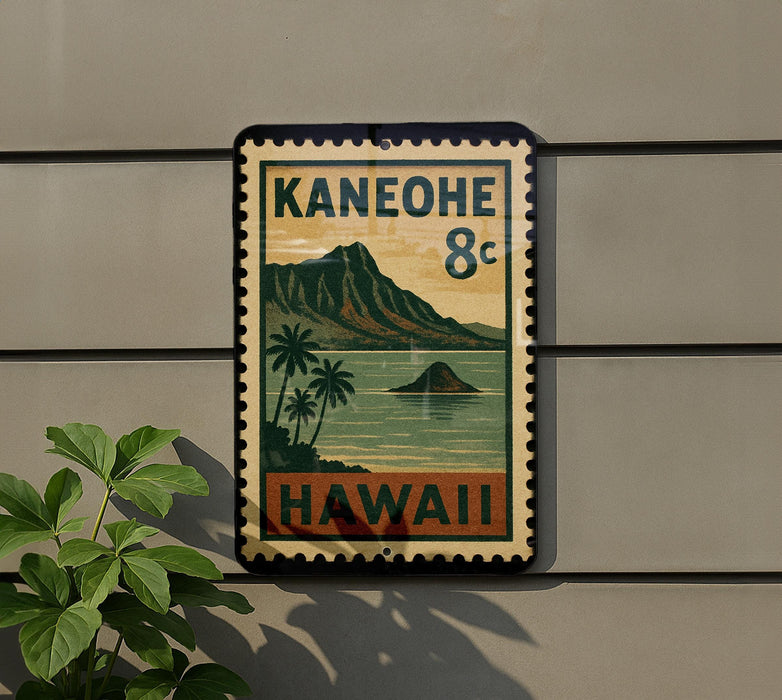 A vintage-style sign with the text "Kaneohe 8c" and "Hawaii" printed on it, mounted on a wall next to a plant.