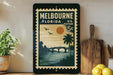 A vintage postage stamp from Melbourne, Florida, featuring a scenic illustration of a bridge, palm trees, and a sunset over the water.