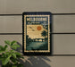 A vintage postage stamp from Melbourne, Florida, featuring a tropical landscape with palm trees, a bridge, and a sunset.