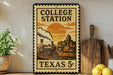 A vintage-style metal sign with a train and a sunset, mounted on a wall next to a wooden cutting board and some potted plants.