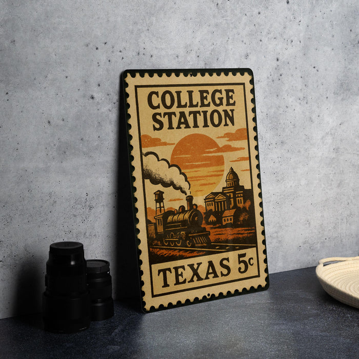A vintage-style metal sign with a train and a sunset in the background, advertising "College Station" in Texas.