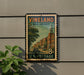 A vintage postage stamp from New Jersey, featuring a street scene with buildings and a clock tower, is displayed on a wall.