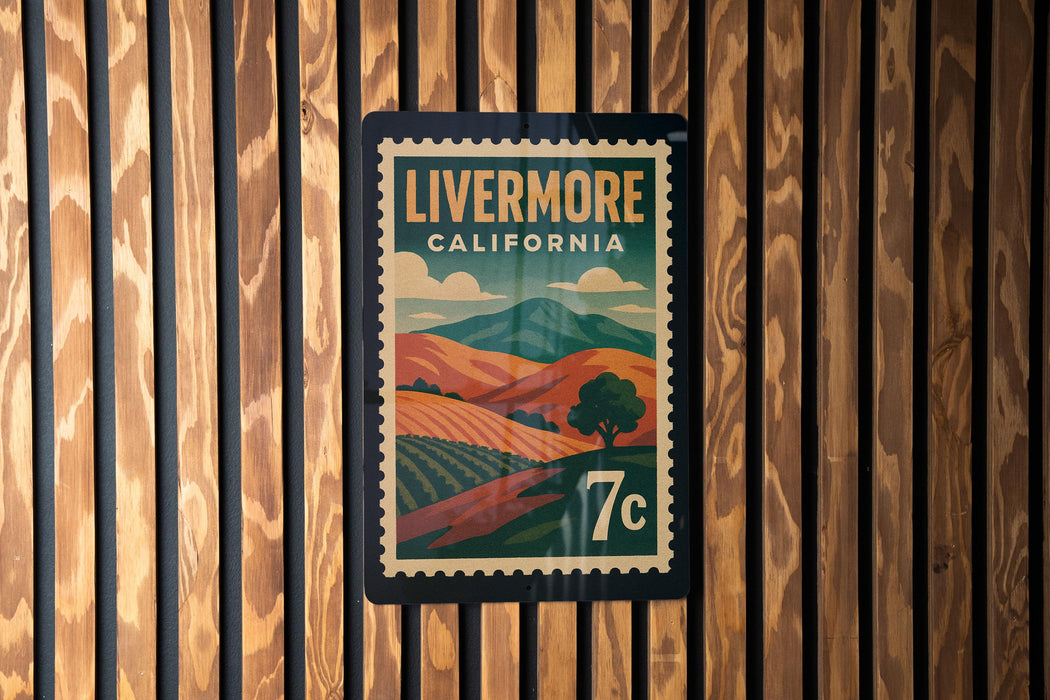 A vintage-style postage stamp from Livermore, California, featuring a landscape with mountains and a tree.