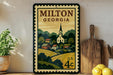 A vintage-style postage stamp depicting Milton, Georgia, with a church and a rural landscape, displayed on a wall next to a wooden cutting board and some lemons.