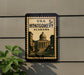 A framed poster of the United States Capitol building in Montgomery, Alabama, mounted on a wall.