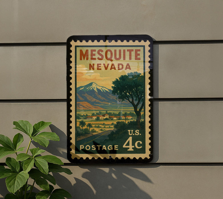A vintage-style postage stamp from the United States, featuring a scenic landscape with mountains and a town, mounted on a wall.