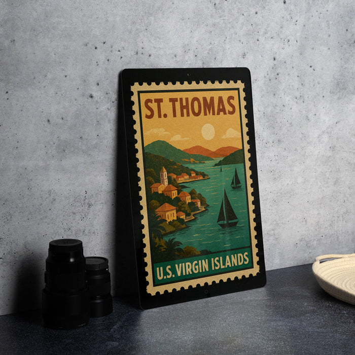 A framed vintage postage stamp depicting St. Thomas, the Virgin Islands, with a scenic illustration of a coastal town and sailboats.
