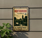 A vintage postage stamp from Illinois, featuring a scenic landscape with a bridge and trees, mounted on a wall.