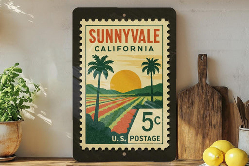 A framed vintage postage stamp from Sunnyvale, California, depicting a tropical landscape with palm trees and a sunset.