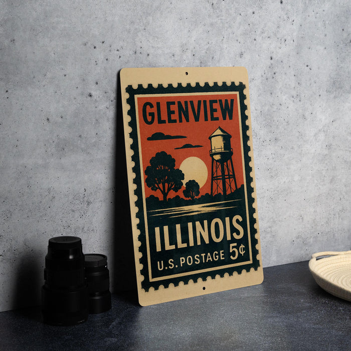 A vintage postage stamp from Illinois, featuring an illustration of a water tower and a sunset, is displayed on a table.