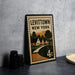 A vintage-style metal stamp with the text "LEVITTOWN NEW YORK" and an illustration of a street scene with houses and trees.
